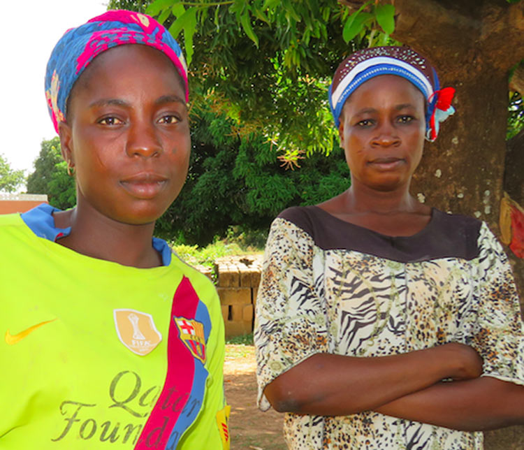 Sakina (left) and community health volunteer Howa Braimah.