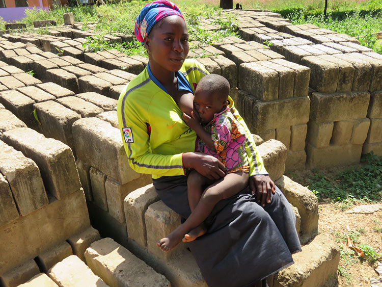 Mother and child on bricks